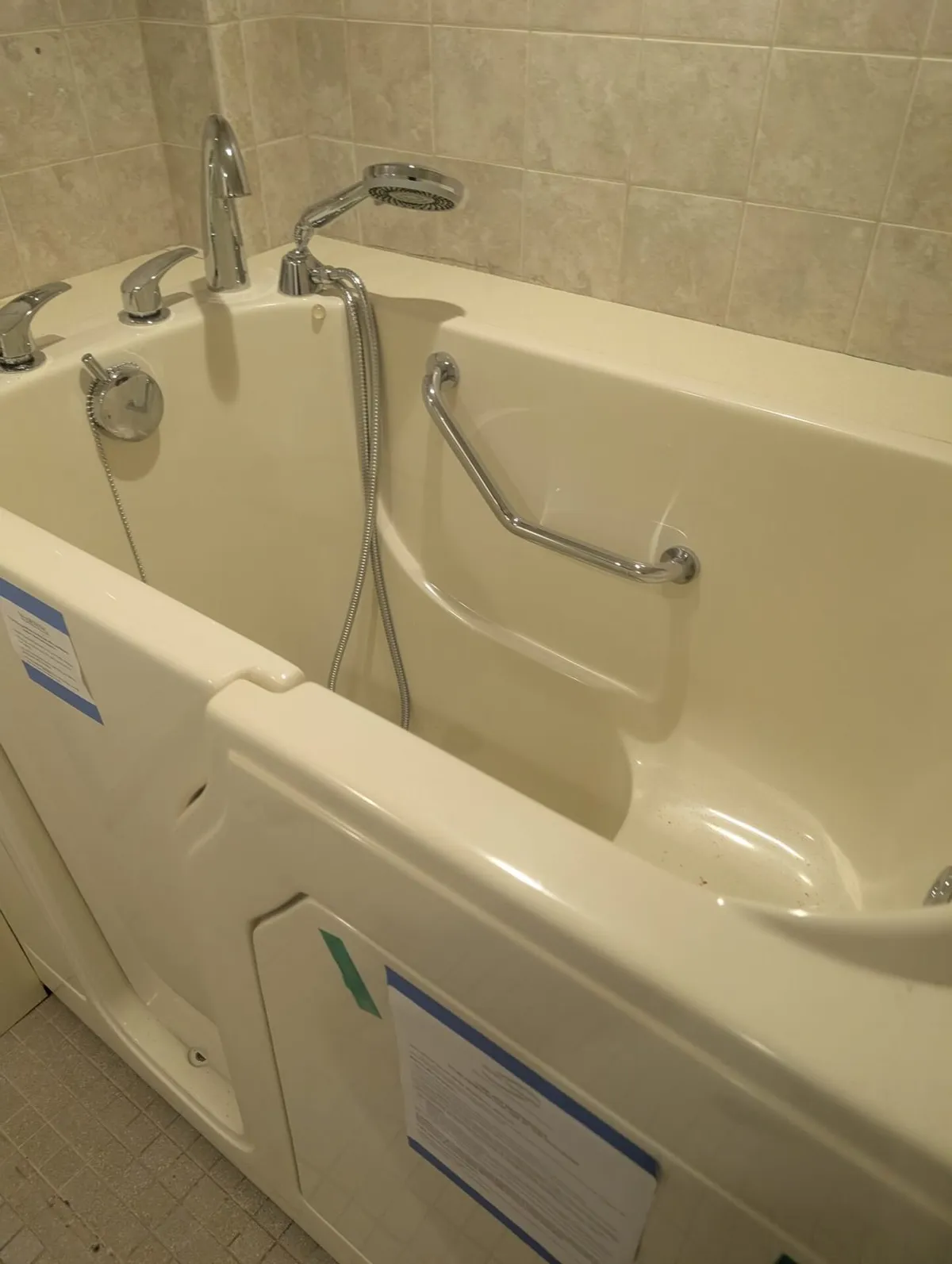 walk in tub for seniors with grab bars and low entry bathroom remodel