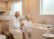 Aging in place bathroom planner woman sitting in walk in tub