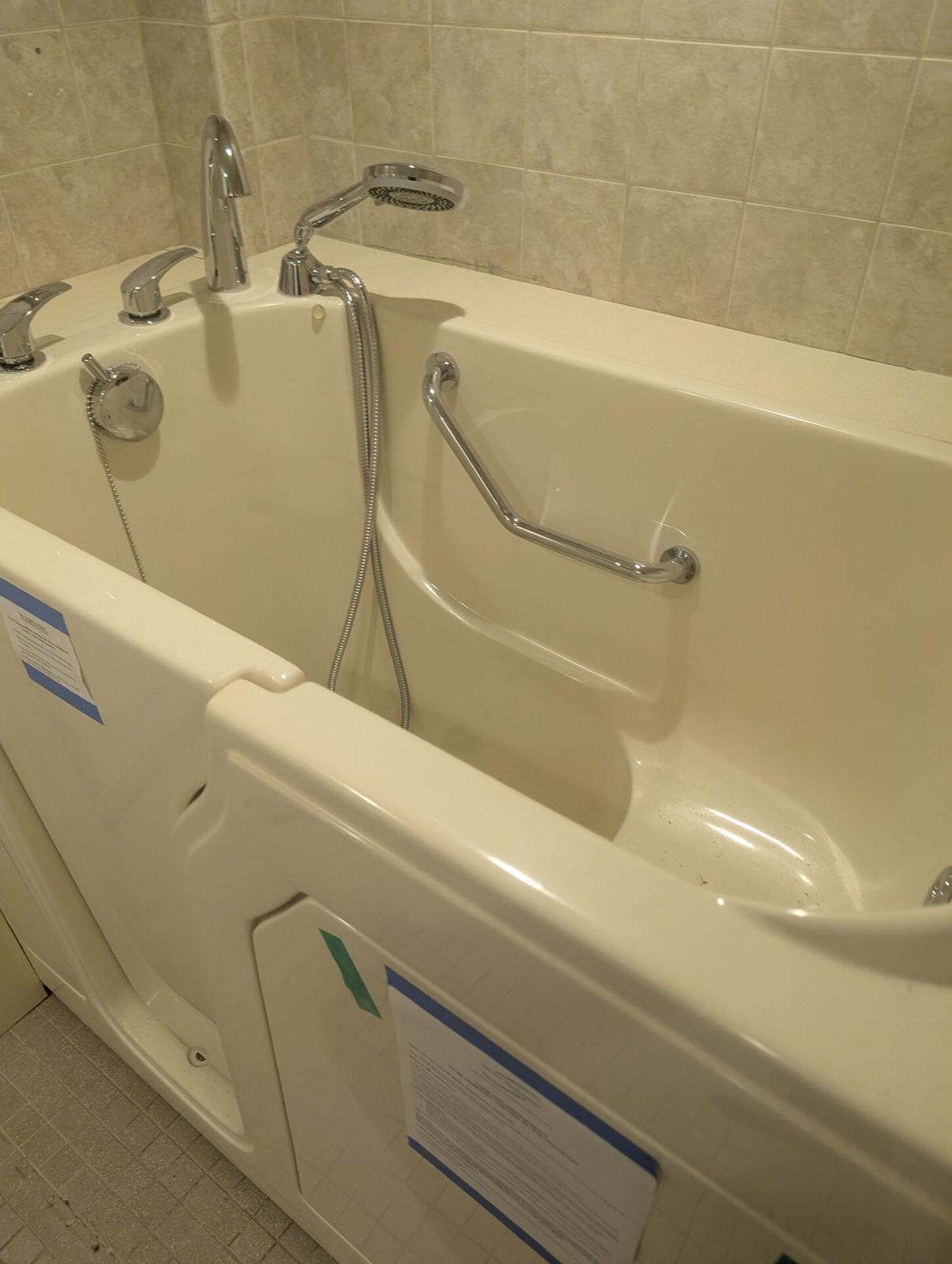 walk in tub for seniors with grab bars and low entry bathroom remodel